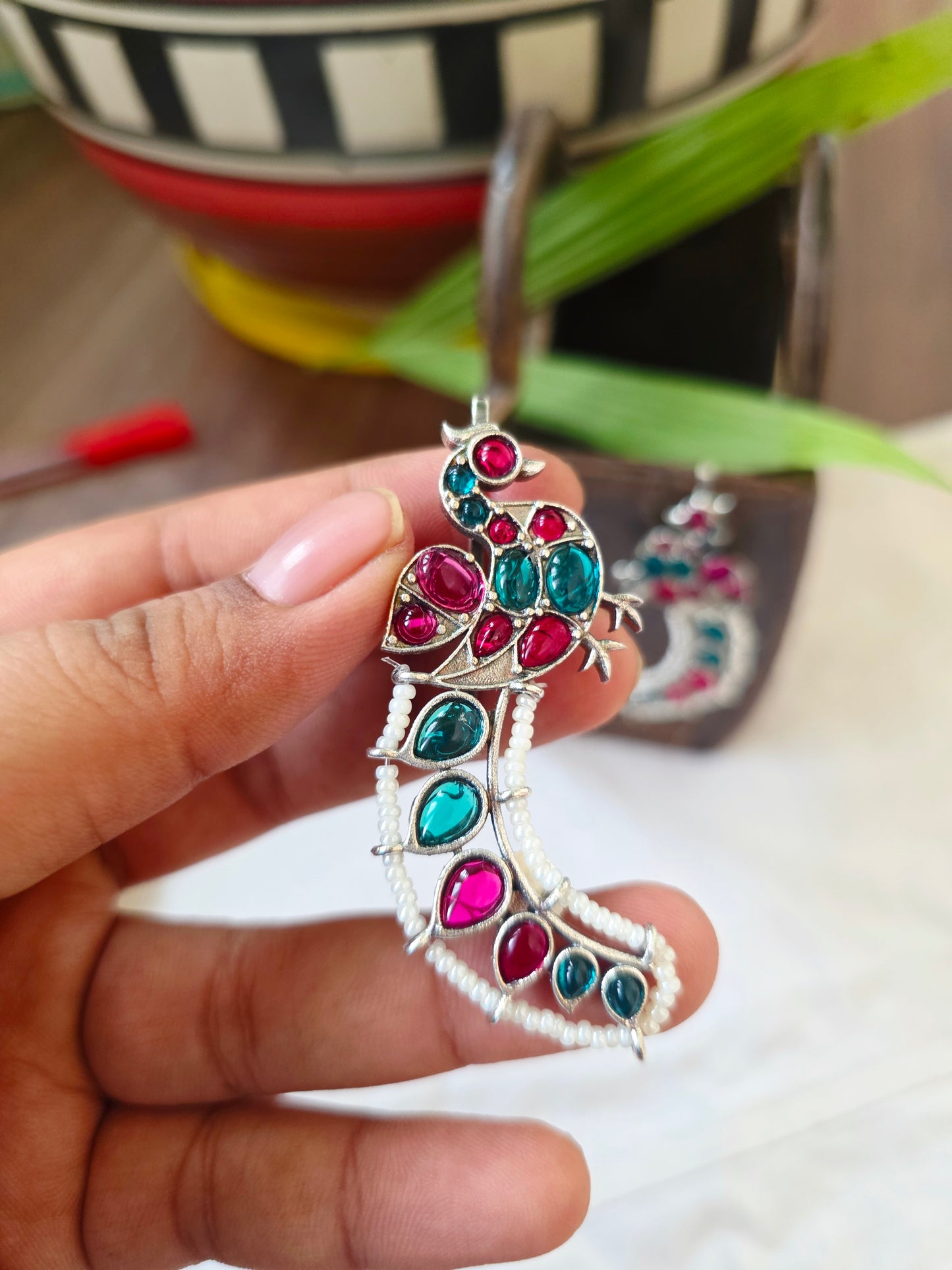 Silver peacock earcuffs