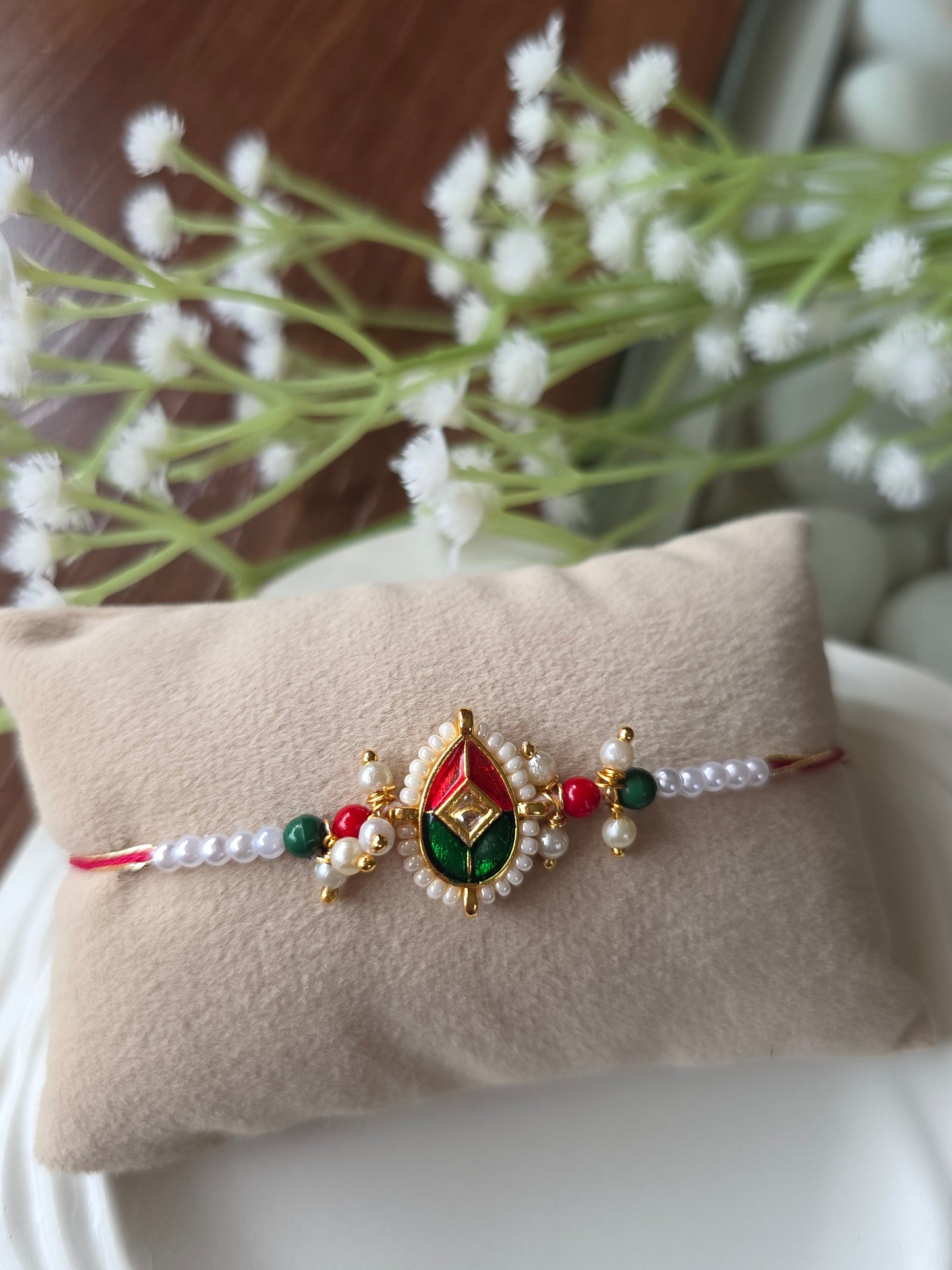 Red green white moti rakhi