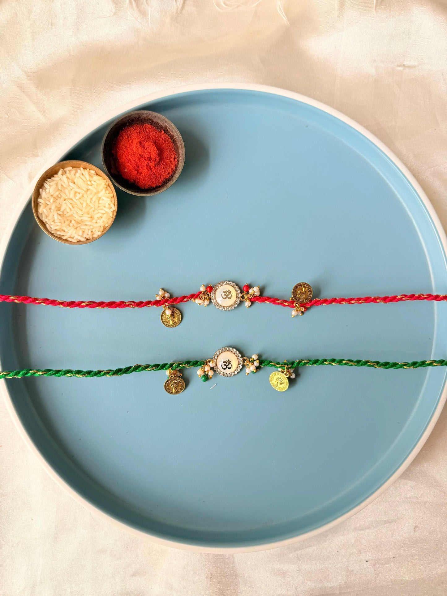 Om & Victoria coin rakhi