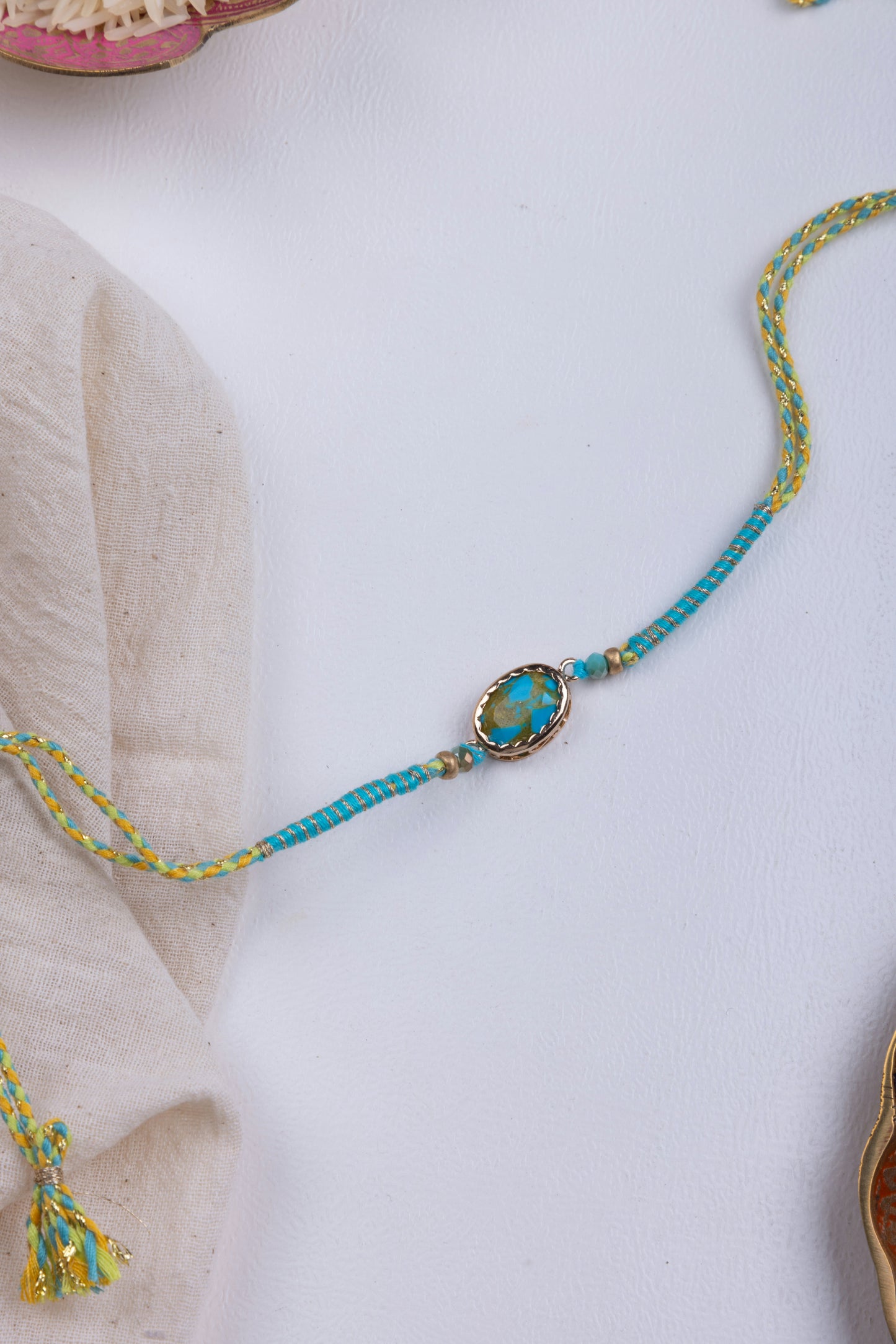 Turquoise thread weave rakhi