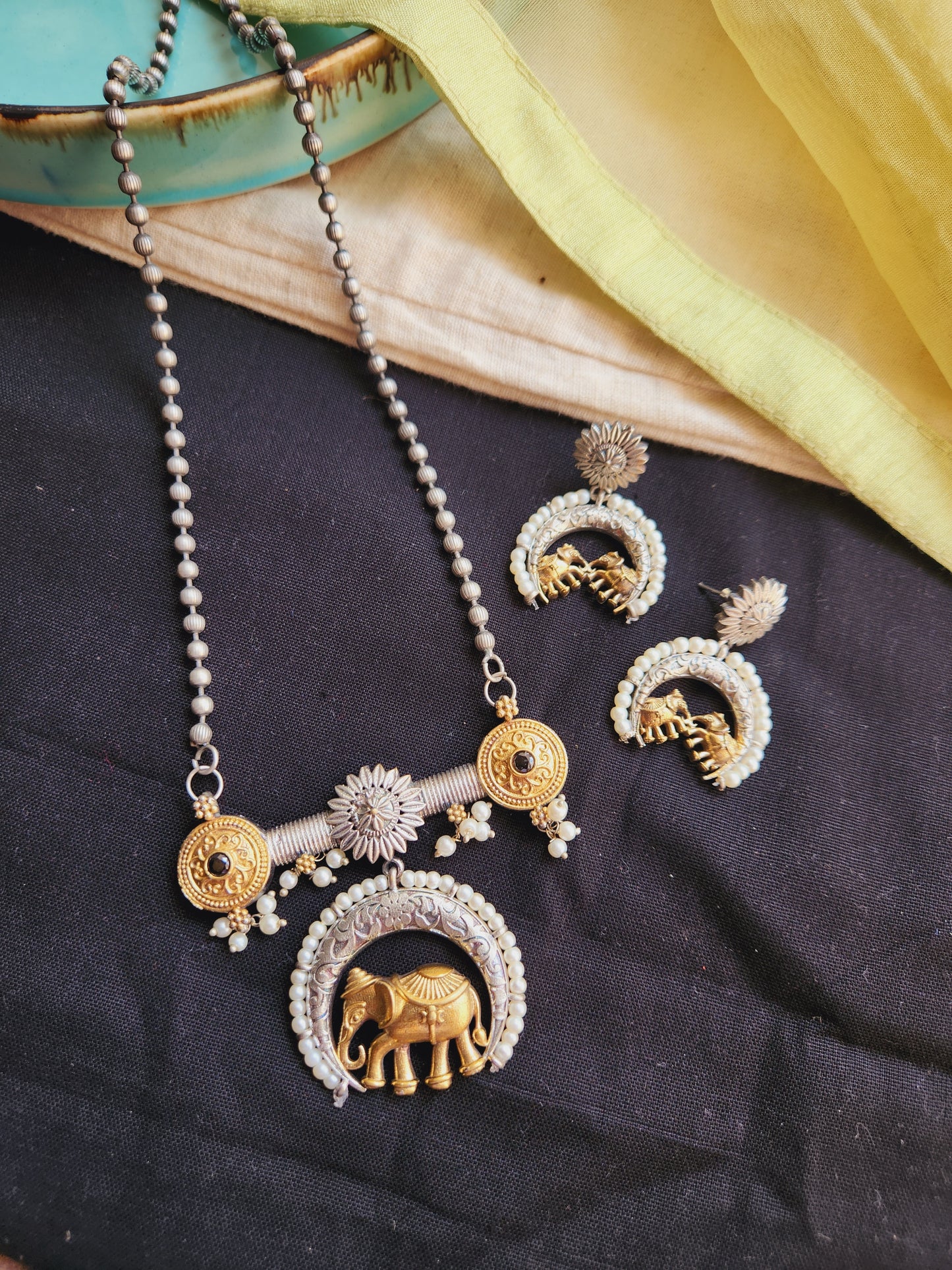 Dual tone elephant necklace