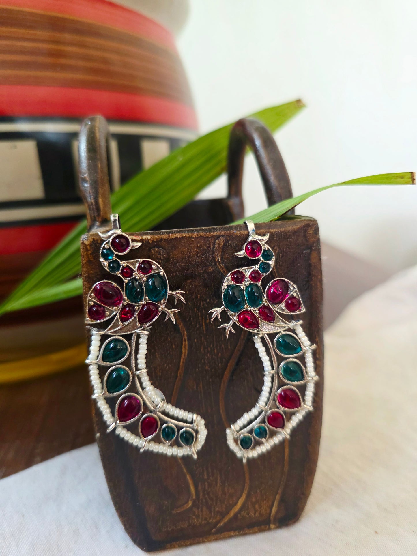 Silver peacock earcuffs