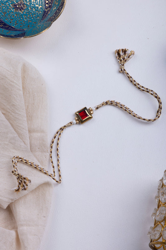 Red stone thread weave rakhi