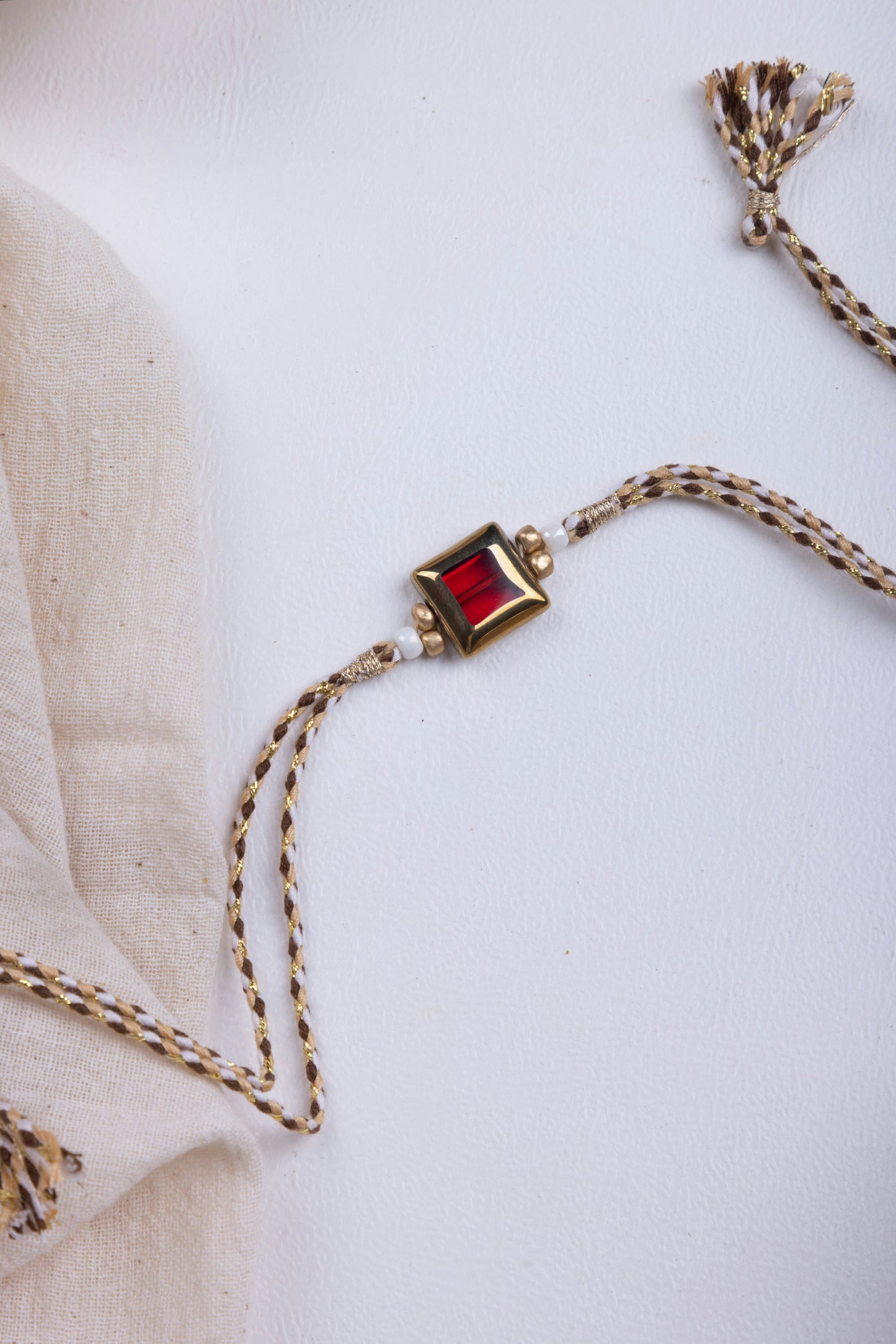 Red stone thread weave rakhi