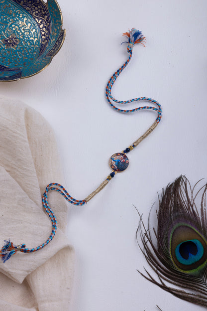 Peacock pichwai thread weave rakhi