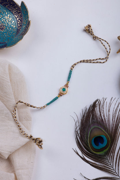 Pearl & turquoise stone thread weave rakhi