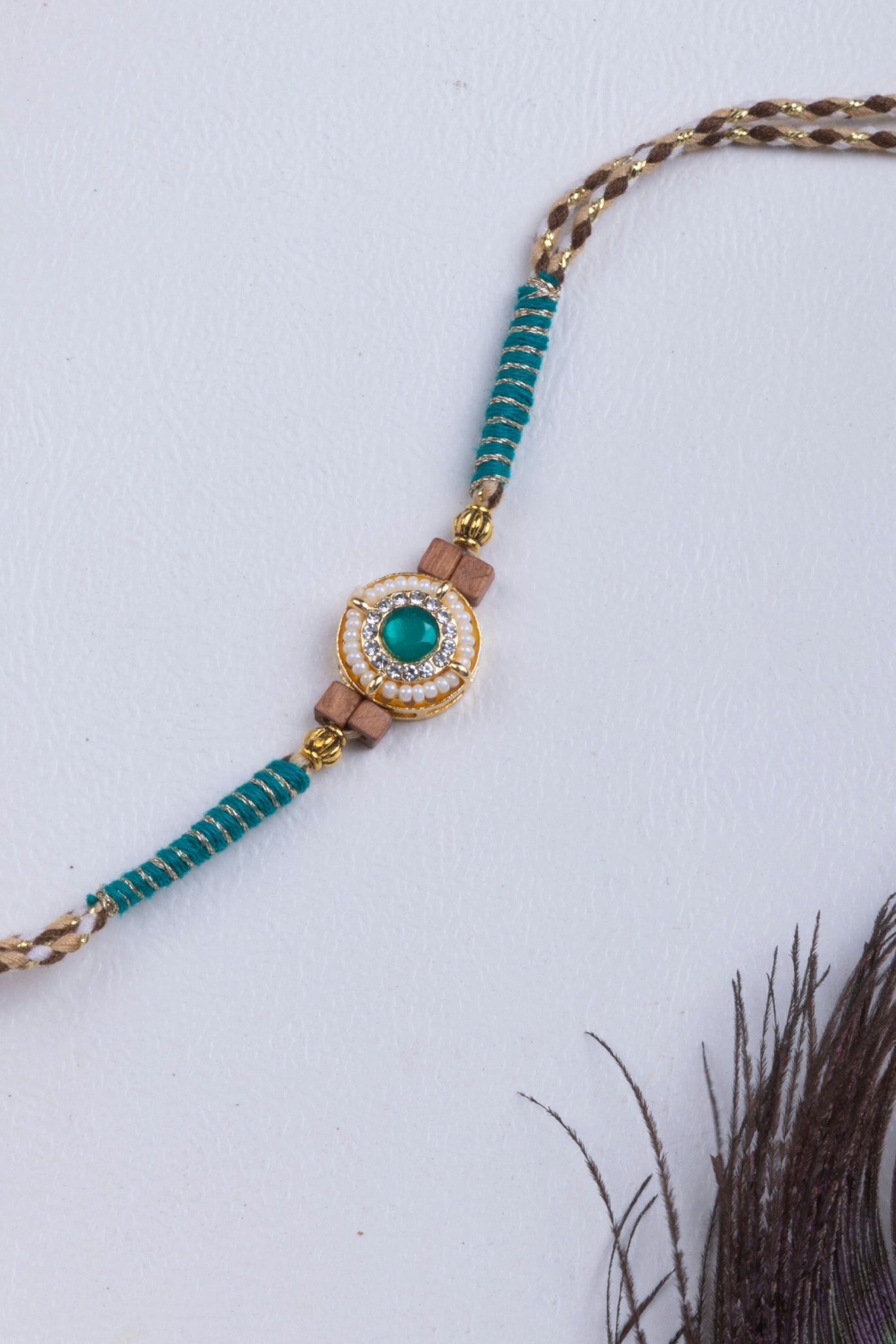 Pearl & turquoise stone thread weave rakhi