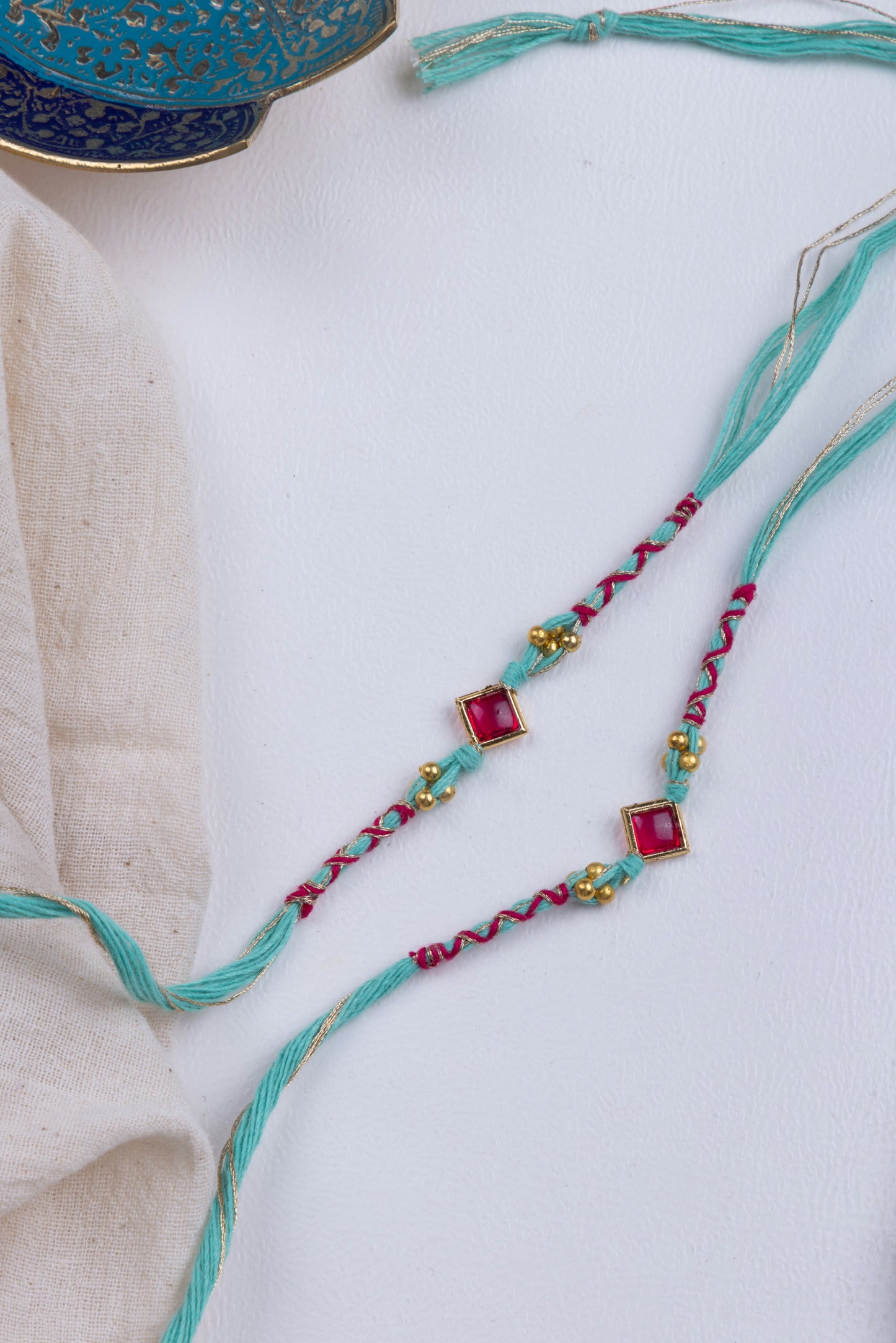 Ruby & turquoise rakhi pack of 2