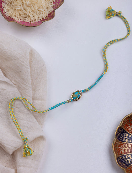 Turquoise thread weave rakhi