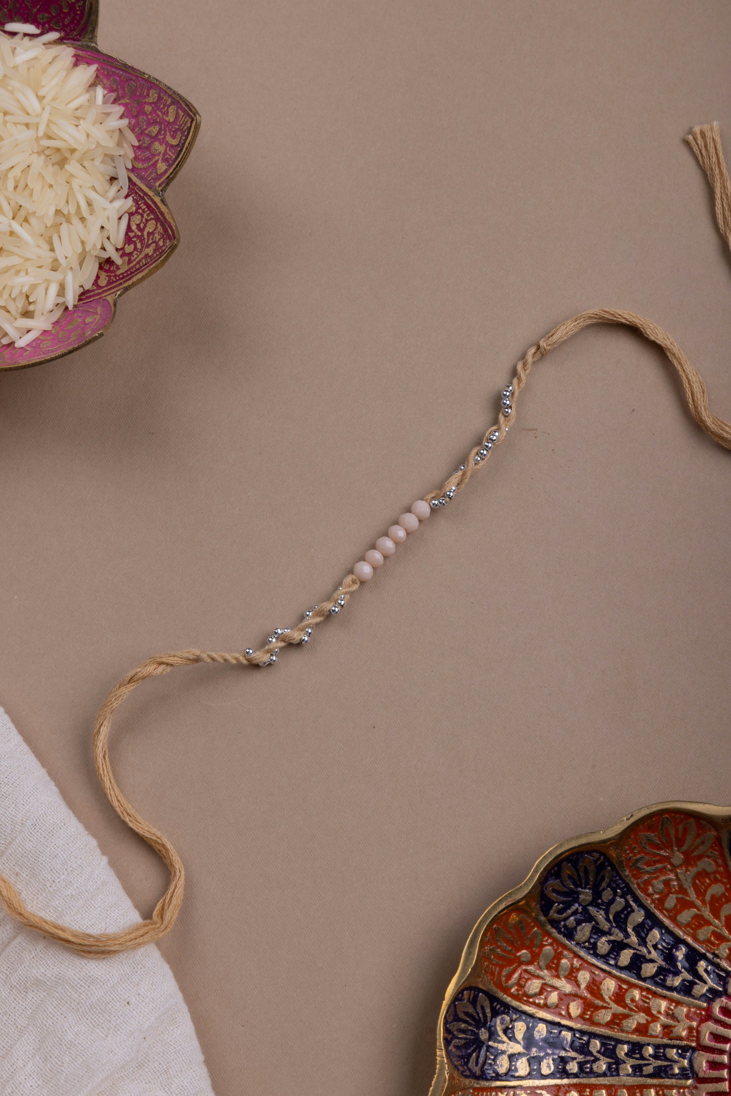 Beige beaded minimal rakhi