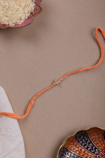 Orange crystal rakhi