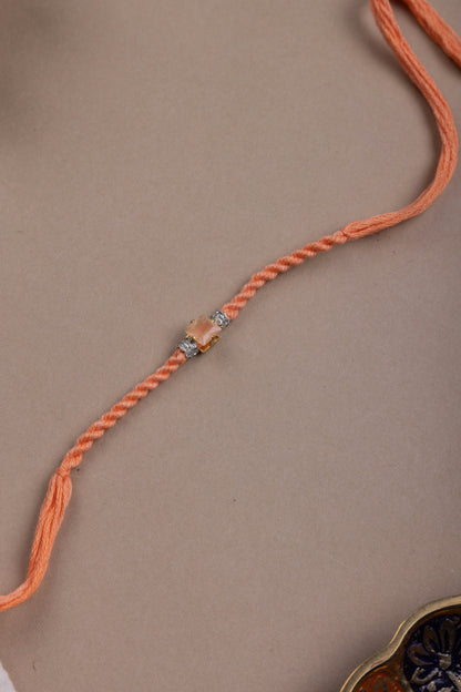 Orange crystal rakhi
