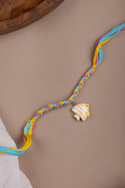 Fish charm pastel thread rakhi