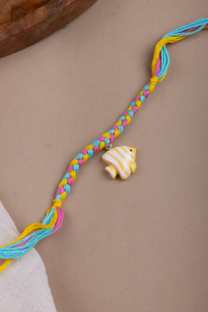 Fish charm pastel thread rakhi