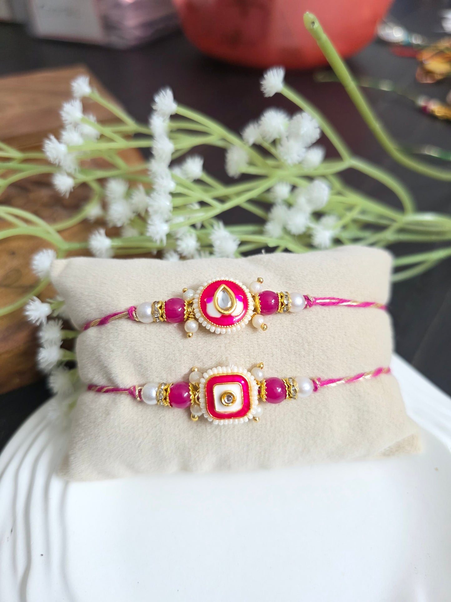 Rani pink meenakari couple rakhi