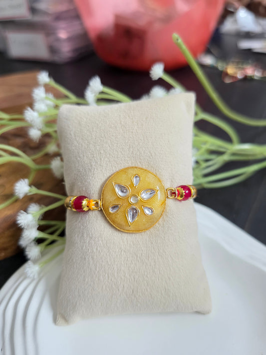 Yellow kundan stone rakhi